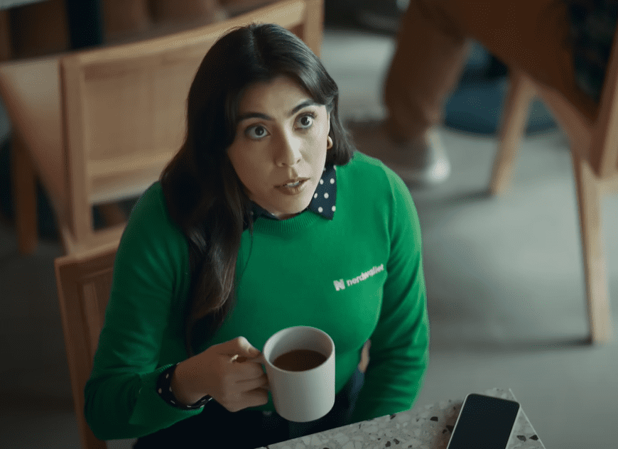 Nerdwallet Commercial Actress in green sweater /shirt: Michelle Ortiz